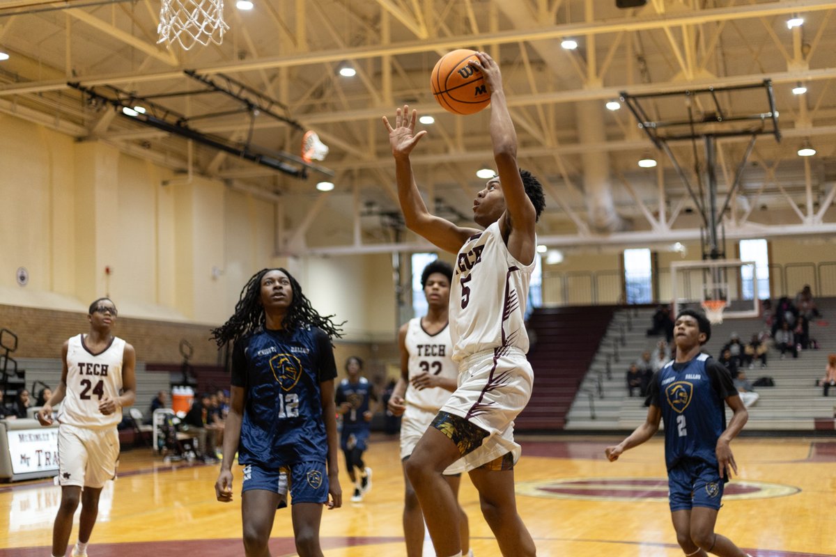 Basketball player going up for a layup